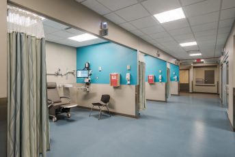 Hospital hallway with medical examination rooms.