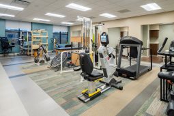 Physical therapy room with exercise equipment.