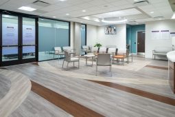 Modern waiting room with chairs and tables.