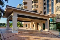 Modern building entrance with covered walkway.