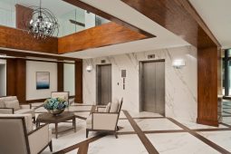Elegant lobby with elevators and seating area.