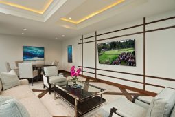 Modern living room with TV and seating.